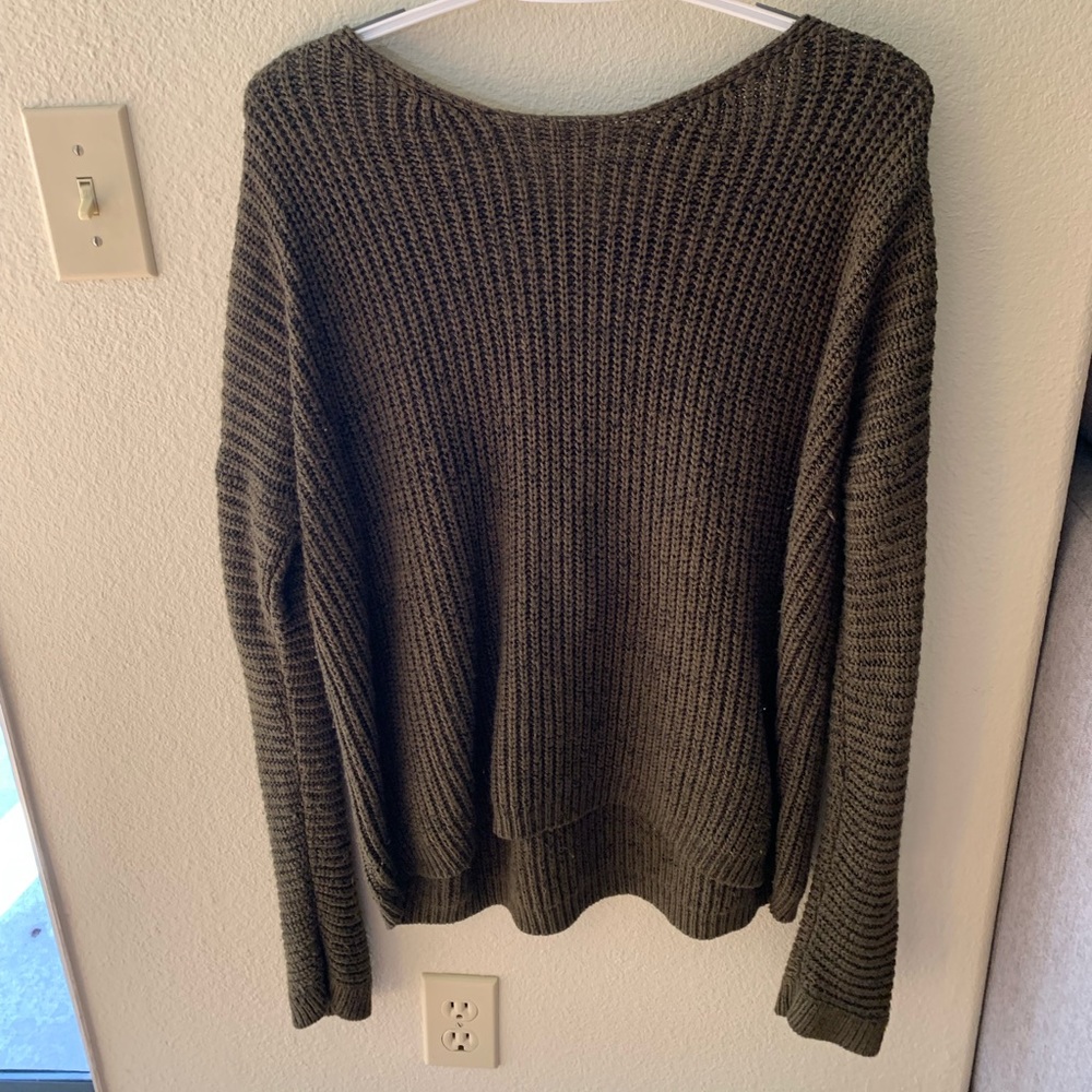Open , cross back knit sweater